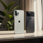 Smartphones showcase camera lenses with natural light pouring from a large window and lush greenery surrounding the desk