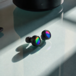 Soundcore P20I Earbuds resting on a modern desk with natural light highlighting colorful accents