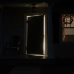 Empty Columbus home door stands ajar with dim light spilling onto porch and Christmas lights glowing through windows