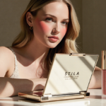 Young woman applying lip cream with gentle natural light over mirror and product near vanity
