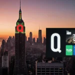 City skyline glows at sunset with Netflix logo on Empire State Building and Disney Plus on Hollywood Sign