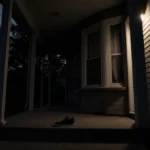 A lone shoe lies abandoned on a porch step with dim interior light and dark curtains.