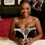 Teyana Taylor holding crystal thong award with tears of joy at Golden Globes ceremony