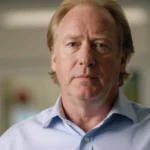 Timothy Busfield smiling warmly with professional headshot style