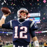 Tom Brady holds a worn football with his Patriots jersey gleaming under stadium lights and fans cheering behind him