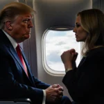Donald Trump gripping Air Force One seat with Kayleigh McEnany clenching fists showing tense political moment