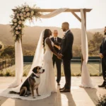 Venus Williams stands at the altar with her husband and senior dog against golden hills and distant tennis courts